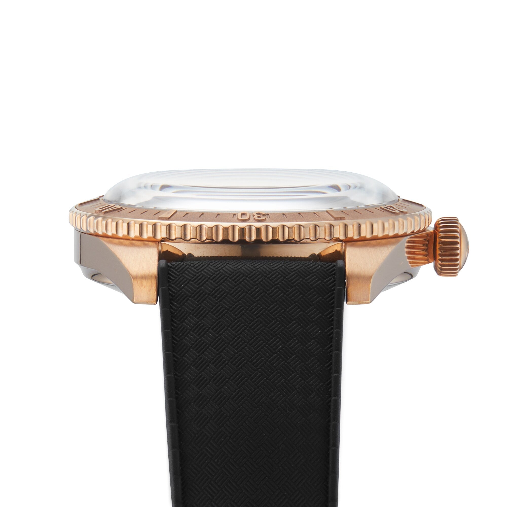 Side view of the Oris Divers Sixty-Five Date, a retro diver’s watch with a bronze case, ridged bezel, domed glass, and black textured strap.