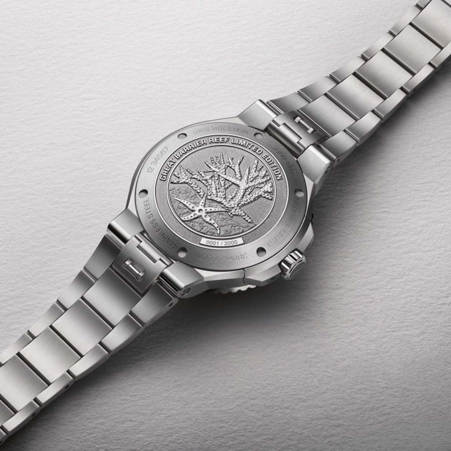 A close-up of the Oris Great Barrier Reef Limited Edition IV’s caseback reveals an engraved coral design and text highlighting its status as a limited edition supporting the Great Barrier Reef.