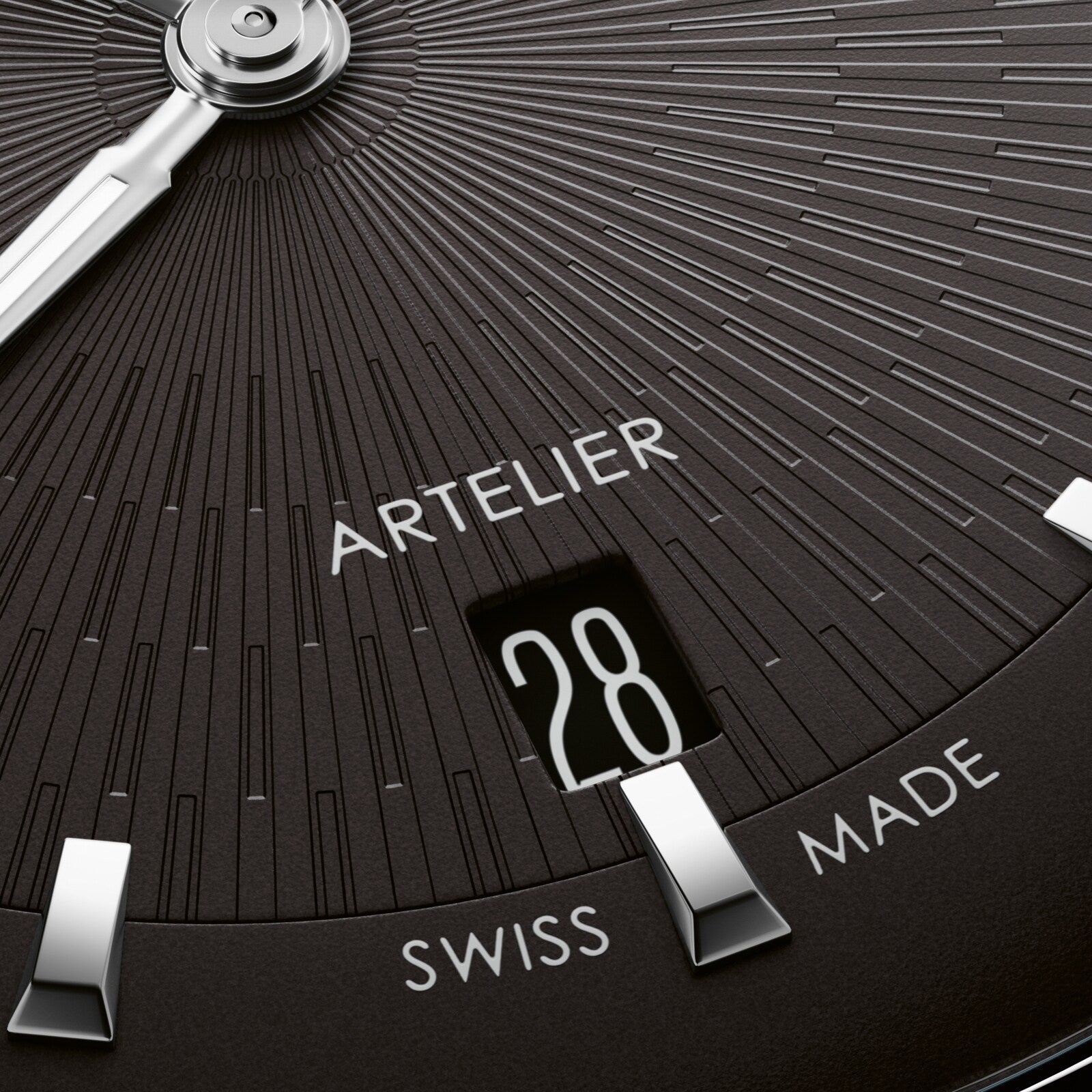 Black dial watch face with radial line pattern, showing date window at 28, Artelier branding, and Swiss Made text, with silve