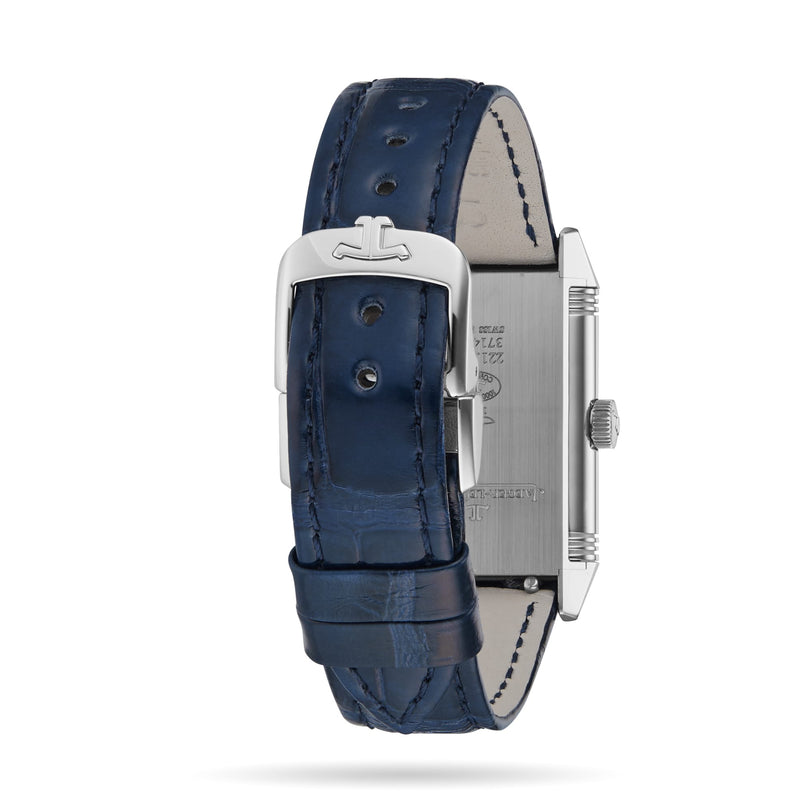A close-up view of a blue leather strap with stitched edges and a silver buckle, attached to the rectangular Jaeger-LeCoultre Reverso Classic Small watch case, highlights the back side of this iconic timepiece.