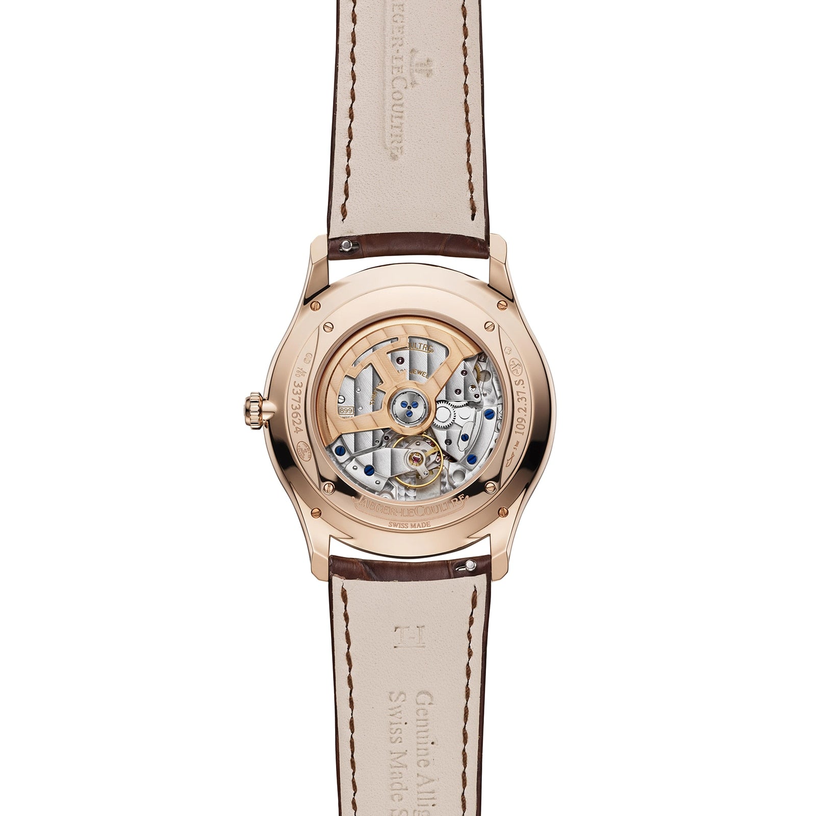 Back view of the Jaeger-LeCoultre Master Ultra Thin Date in pink gold, featuring a transparent case that reveals the Caliber 899 and a brown leather strap with "Jaeger-LeCoultre" engraved on both case and strap.