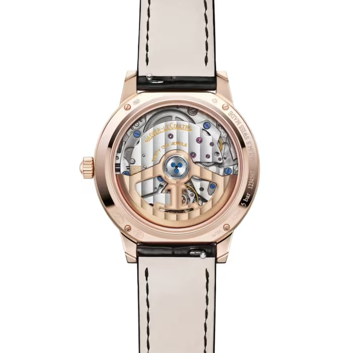 The back view of the Jaeger-LeCoultre Rendez-Vous Moon Medium reveals its intricate mechanical movement through a transparent case, featuring a gold rim and a black leather strap with white stitching.