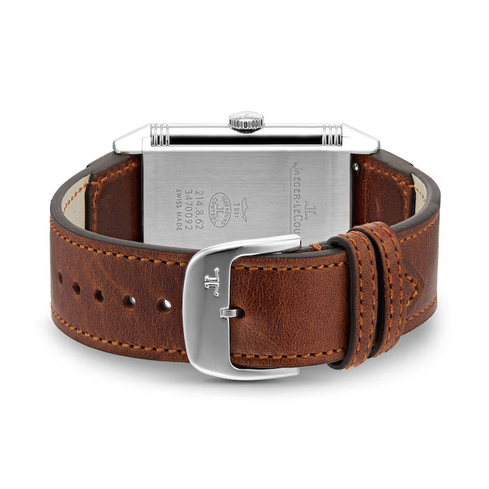 A close-up of a brown leather strap with white stitching and a silver Jaeger-LeCoultre buckle, along with the back of a rectangular stainless steel Reverso Classic Large Small Seconds watch case.