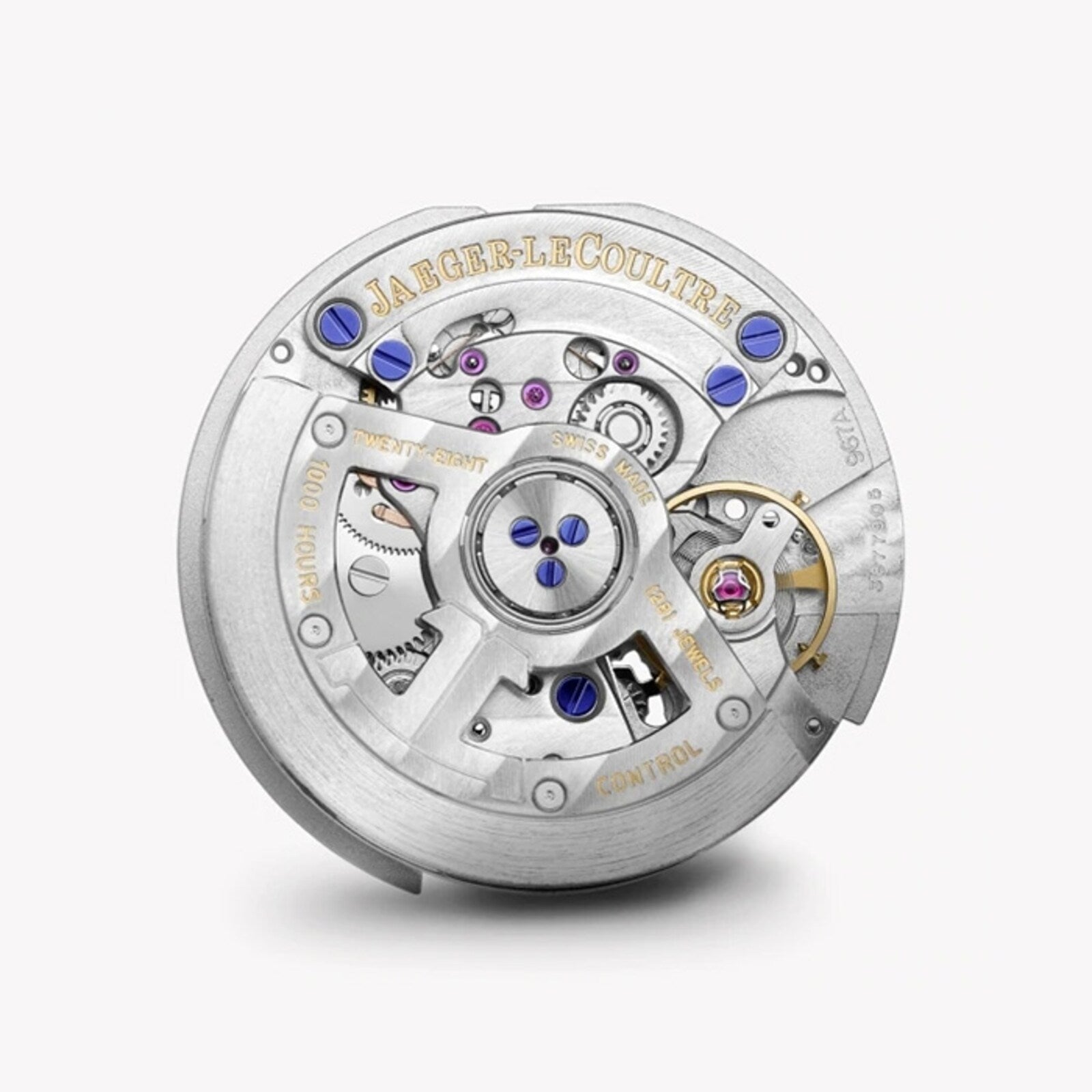 A close-up of the Swiss-made Jaeger-LeCoultre Rendez-Vous Night & Day watch movement, highlighting detailed metal gears, jewel bearings, screws, and engraved branding on the silver components.