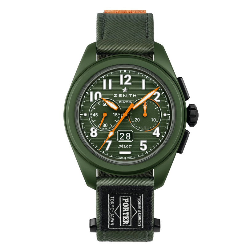 The Zenith Limited Edition Pilot Big Date Flyback Porter features a khaki-green ceramic case, fabric strap with Tokyo Porter branding, white numerals, orange hands, and subdials.