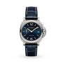 The Panerai Luminor Due is a luxury ladies watch featuring a blue dial, gold-tone hands and markers, date display, small seconds subdial, and dark blue leather strap with white stitching, all housed in a sleek titanium case.