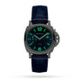The Panerai Luminor Due Luna Moonphase features a dark blue leather strap, a black round case, and glowing green numerals and hands, highlighting Italian luxury design against a plain white background.