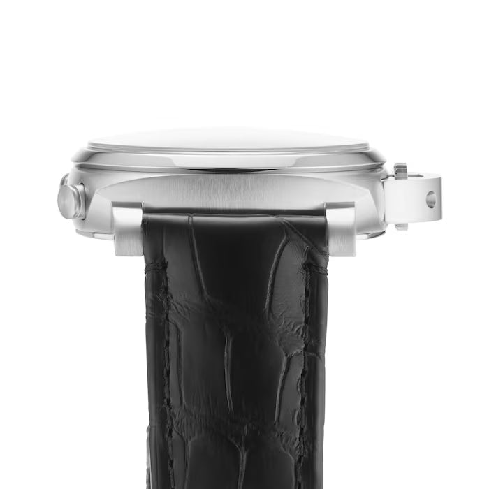 A side view of the Panerai Luminor Chrono features its silver case, black leather strap, crown, and lugs in close detail against a white background.