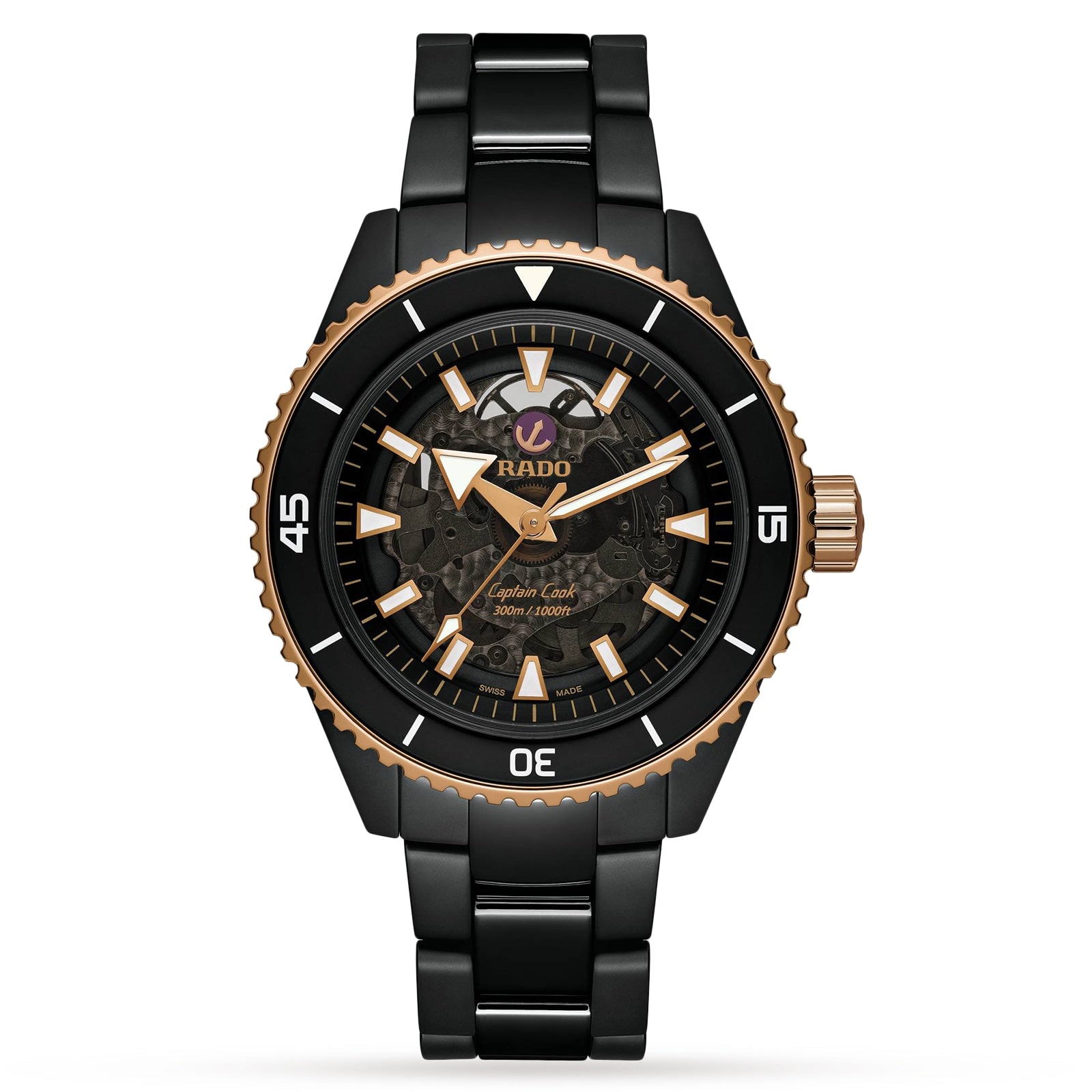 A Rado Captain Cook High-Tech Ceramic wristwatch with a black and gold skeleton dial, Nivachron™ hairspring, ceramic bezel, stainless steel bracelet, and displaying the time 10:10.
