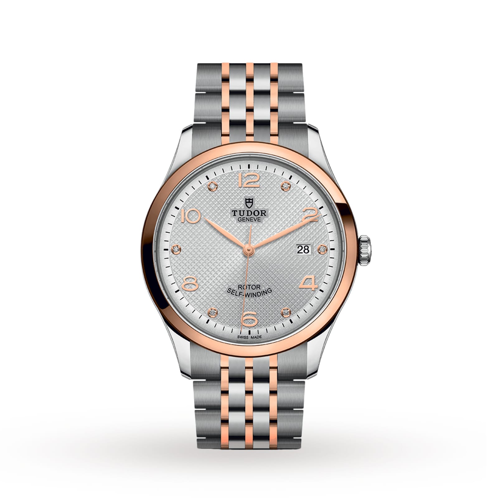 The TUDOR 1926 features a silver and rose gold metal band, silver textured dial, gold hour markers, date display at 3 o’clock, and a reliable self-winding mechanical movement.