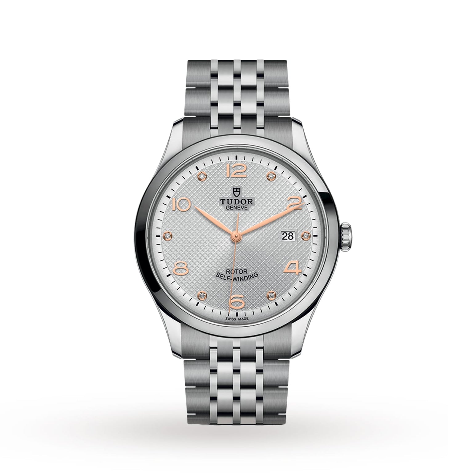 The TUDOR 1926 wristwatch features a silver metal bracelet, silver textured dial, gold-tone markers and hands, self-winding movement, and a date display at 3 o’clock.