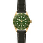 The TUDOR Black Bay 58 18K is a green and gold divers watch with a black leather strap, rotating bezel, and three hands, shown against a white background.