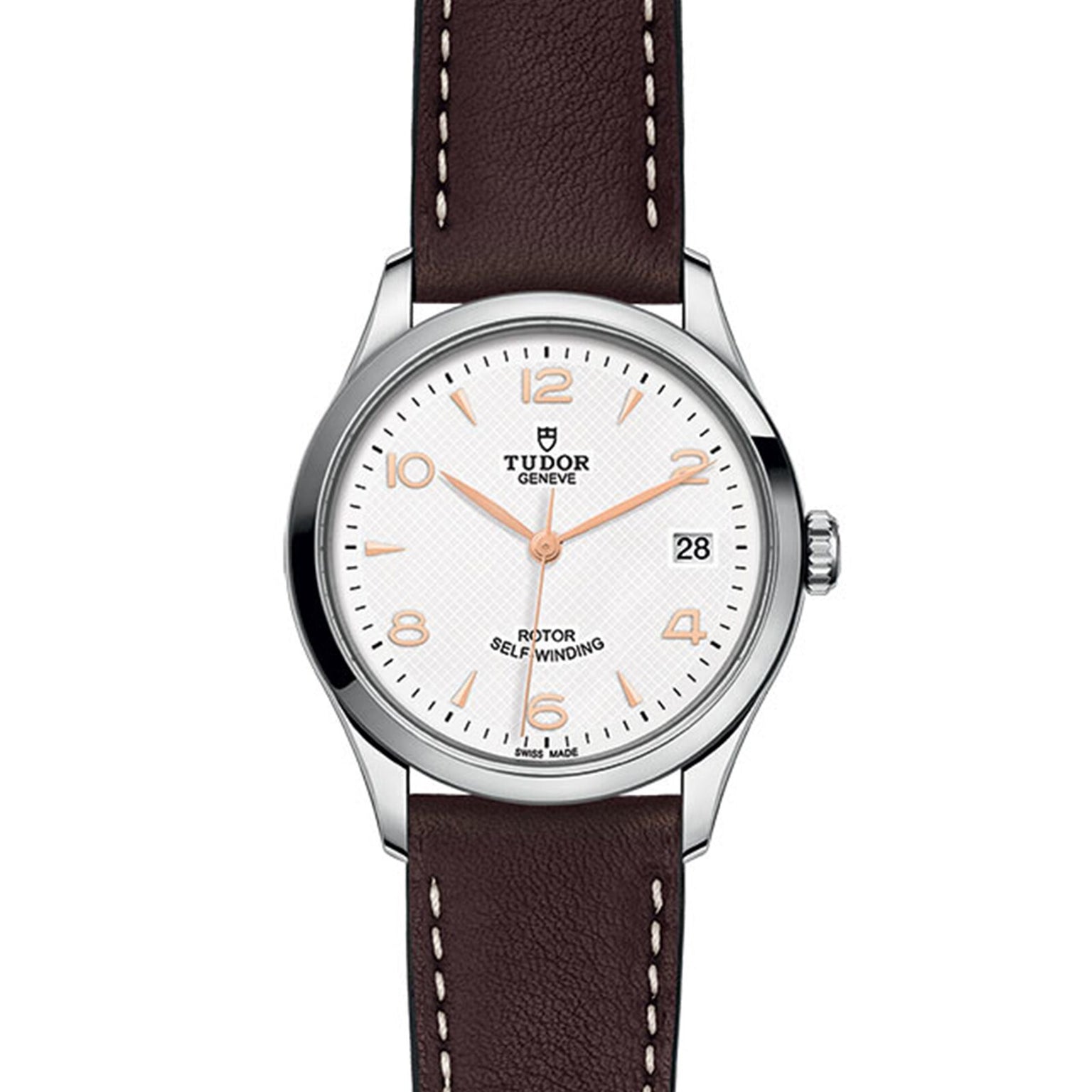 The TUDOR 1926 wristwatch features a white dial, brown leather strap, and date display at 3 o’clock.