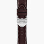 Close-up of a brown leather TUDOR 1926 watch strap featuring white stitching and a silver clasp engraved with the TUDOR logo.