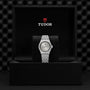 A TUDOR Royal sport-chic automatic watch with a silver and gold band is displayed upright in a black presentation box featuring the Tudor logo and emblem above it.