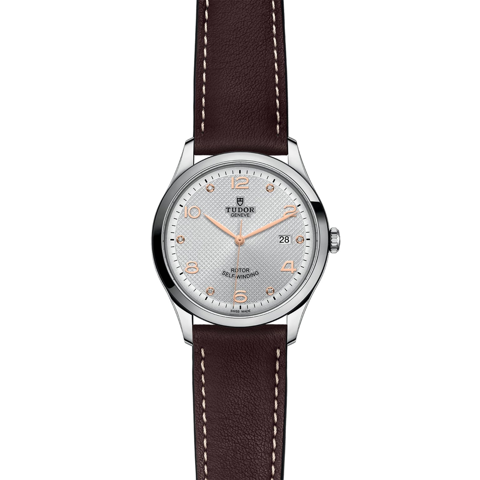 The TUDOR 1926 is a classic silver wristwatch with a round face, brown leather strap, rose gold markers and hands, and a date window at 3 o’clock—ideal for fans of elegant mechanical timepieces.