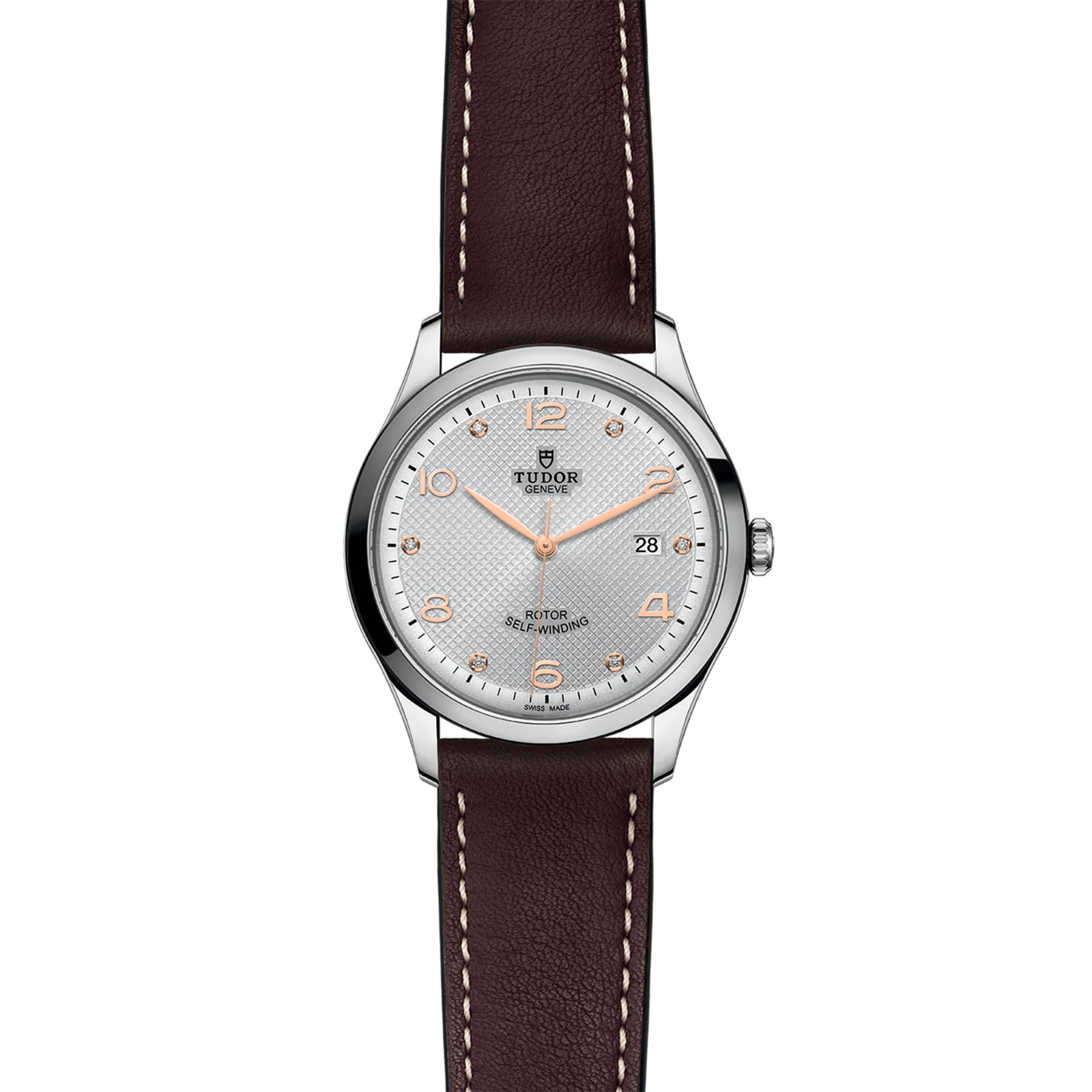 The TUDOR 1926 is a classic silver wristwatch with a round face, brown leather strap, rose gold markers and hands, and a date window at 3 o’clock—ideal for fans of elegant mechanical timepieces.