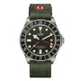 The TUDOR Pelagos FXD GMT watch features a green fabric strap, black bezel, and displays both date and time.