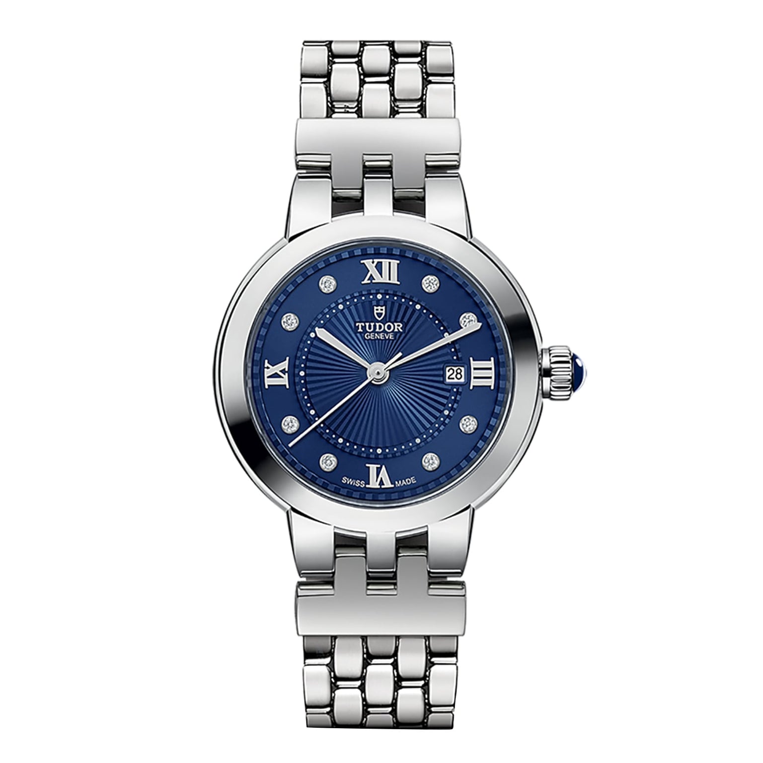 The TUDOR Clair de Rose is a silver wristwatch featuring a blue dial, Roman numerals, and a date window at 3 o’clock.