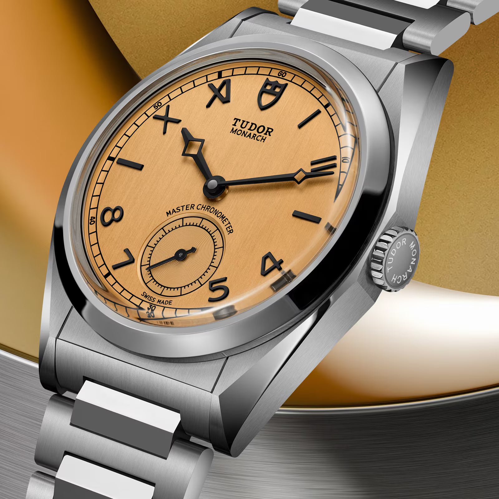 TUDOR Monarch watch with champagne dial, black Roman numerals, steel case and bracelet, Master Chronometer subdial.