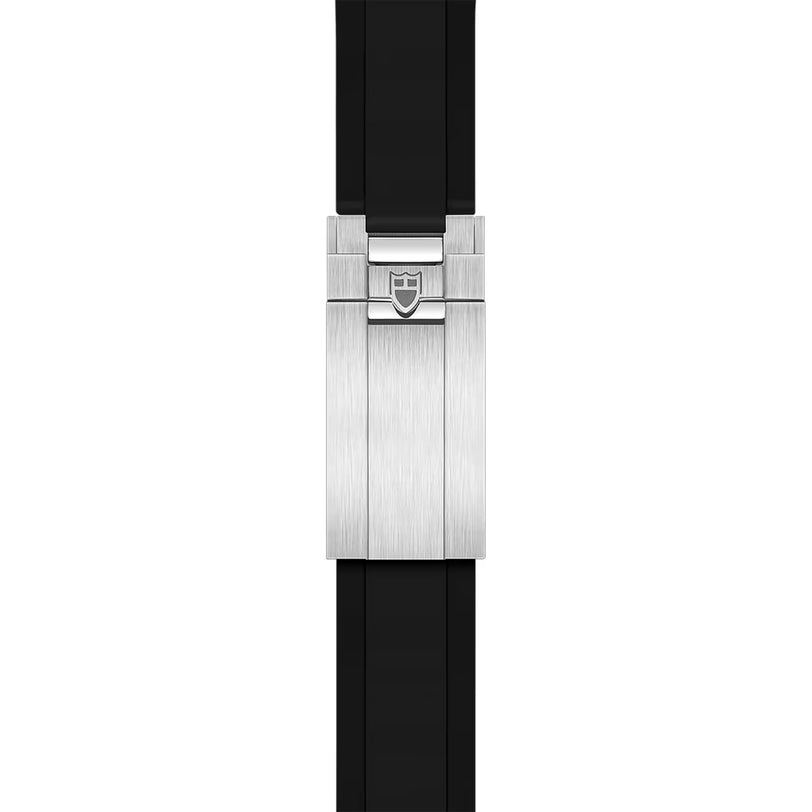 Silver-tone watch case with brushed finish and shield logo on black rubber strap.