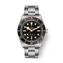 Tudor Black Bay 58 watch with stainless steel bracelet, black dial, and bezel with applied indices.