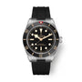 Tudor Black Bay 58 watch with brushed steel case, black dial, luminous hour markers, and black rubber strap.