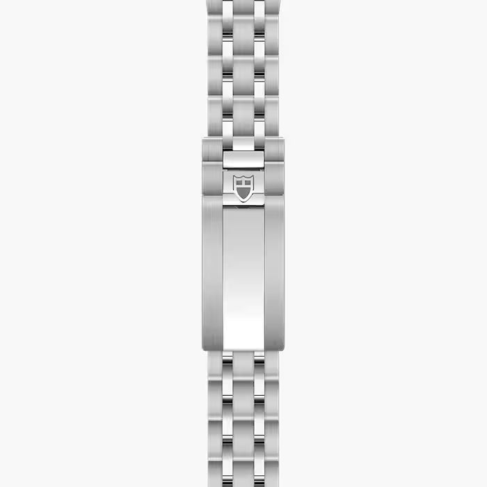 Stainless steel watch bracelet with polished and brushed links, featuring a shield-shaped clasp logo.
