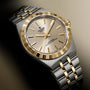 TUDOR Royal watch with silver and gold two-tone case, cream dial, and matching bracelet.