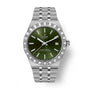 TUDOR Royal stainless steel watch with green dial, date window, and matching bracelet.
