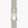 Two-tone stainless steel and gold bracelet with shield emblem clasp for TUDOR Royal watch.