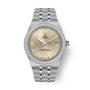 Steel watch with champagne dial, diamond bezel, date window, and steel bracelet.