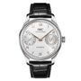 The IWC Schaffhausen Portugieser Automatic 42 features a silver case, white dial with gold markers, two subdials, date at 6 o’clock, and a black leather strap.