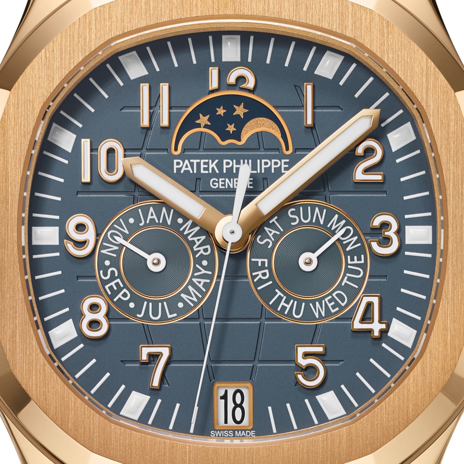 Close-up of the Patek Philippe Aquanaut 5261R-001 watch, featuring a blue face, gold hands, moon phase display, date feature, and calendar subdials.