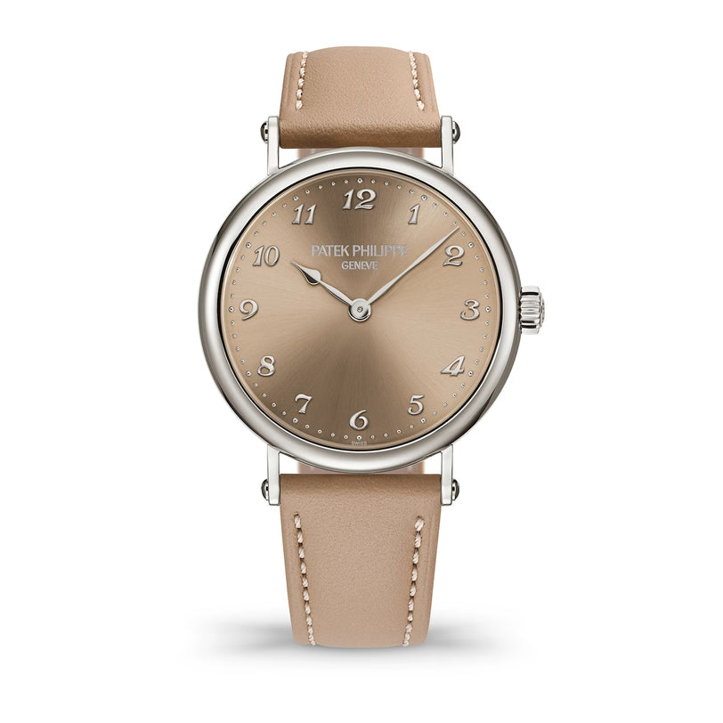 Watch with beige strap and brown dial on a white background