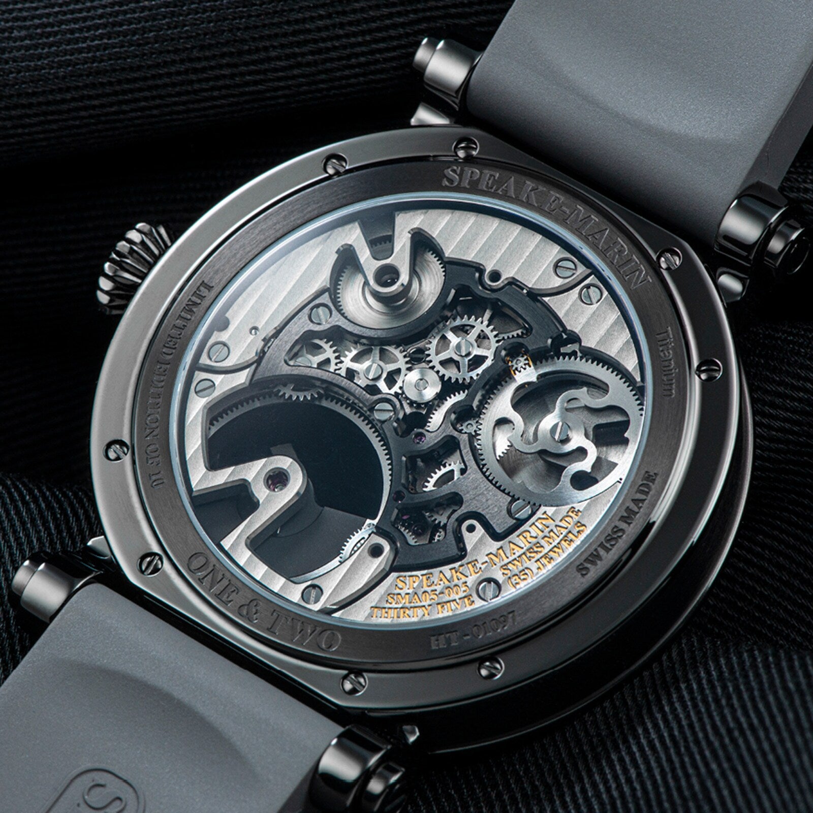 Close-up of the Speake Marin Openworked Tourbillon Black DLC’s transparent case back showcasing its intricate gears and mechanical movement.