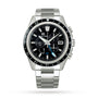 The Grand Seiko Spring Drive Chronograph Evolution 9 in High-Intensity Titanium features a black bezel and dial, multiple subdials, date window, blue GMT hand, and is shown on a metal bracelet against a white background.