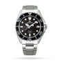 The Grand Seiko Spring Drive GMT Evolution 9 features a textured black dial inspired by Japanese nature, bold white hour markers, date at 3 o’clock, black unidirectional bezel, and stainless steel bracelet.