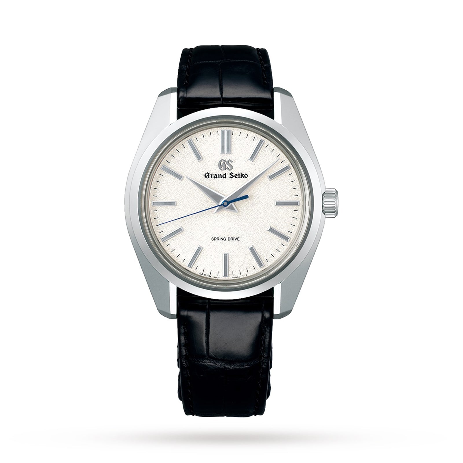 A Grand Seiko Spring Drive Heritage watch featuring a silver textured dial, silver indices, black leather strap, and three central hands.