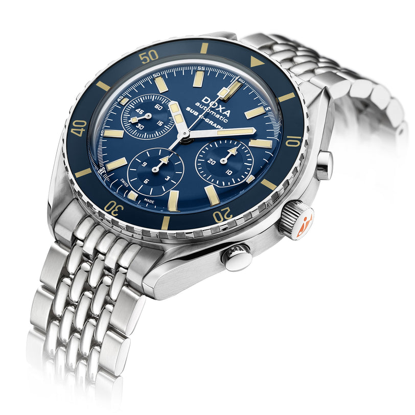 The DOXA Sub 200 C-Graph Caribbean is a stainless steel chronograph wristwatch with a blue dial, three subdials, yellow accents, metal bracelet, and precise Swiss movement.