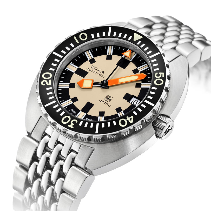 The DOXA Army Stainless Steel watch features a beige dial, black rotating bezel, date display, and orange-accented hands, displayed on a metal bracelet.