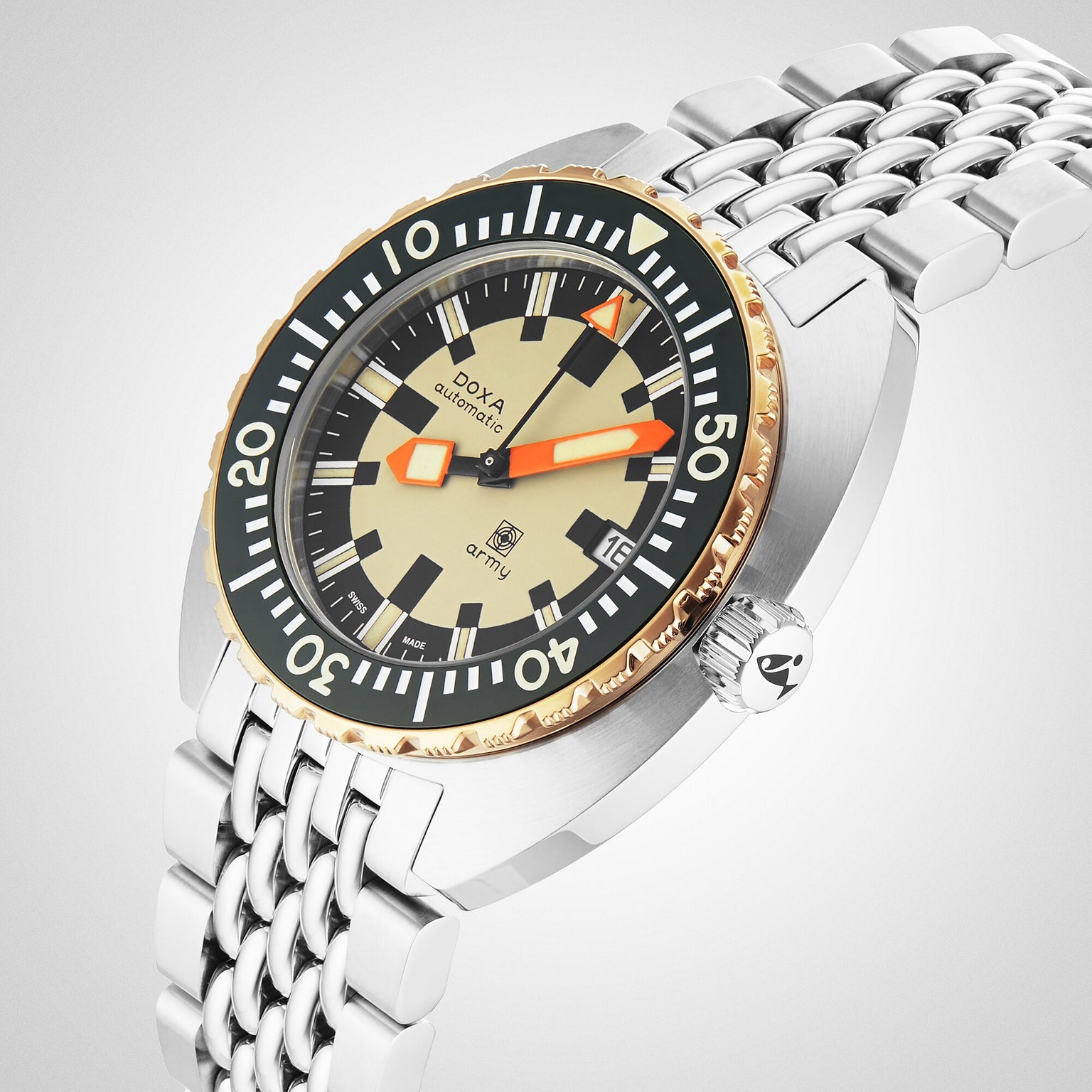 A close-up of the DOXA Army Bronze by DOXA, an automatic dive watch with a beige dial, orange hands, gold bezel, 316L stainless steel bracelet, and Super-LumiNova® coating set against a light background.