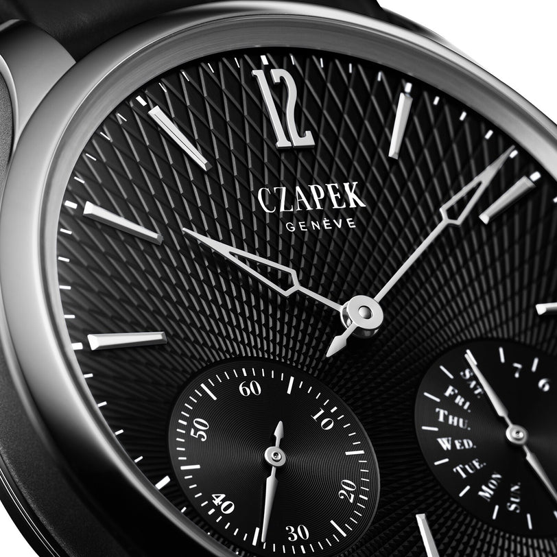 Close-up of the Czapek Quai des Bergues N°17 Double Soleil Tuxedo Black luxury watch, featuring a textured black dial and silver hour markers.