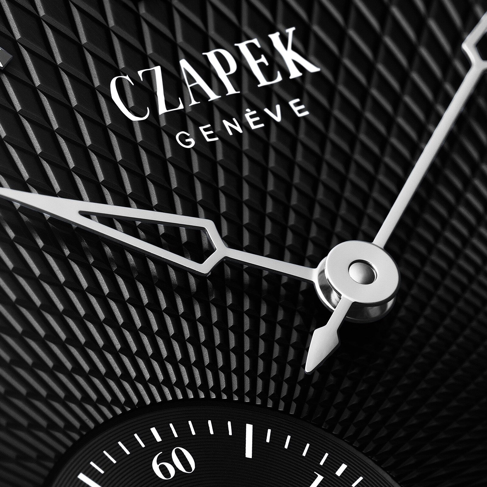 Close-up of the Czapek Quai des Bergues N°17 Double Soleil Tuxedo Black watch face with a textured black background and silver hands.