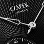 Close-up of the Czapek Quai des Bergues N°17 Double Soleil Tuxedo Black watch face with a textured black background and silver hands.