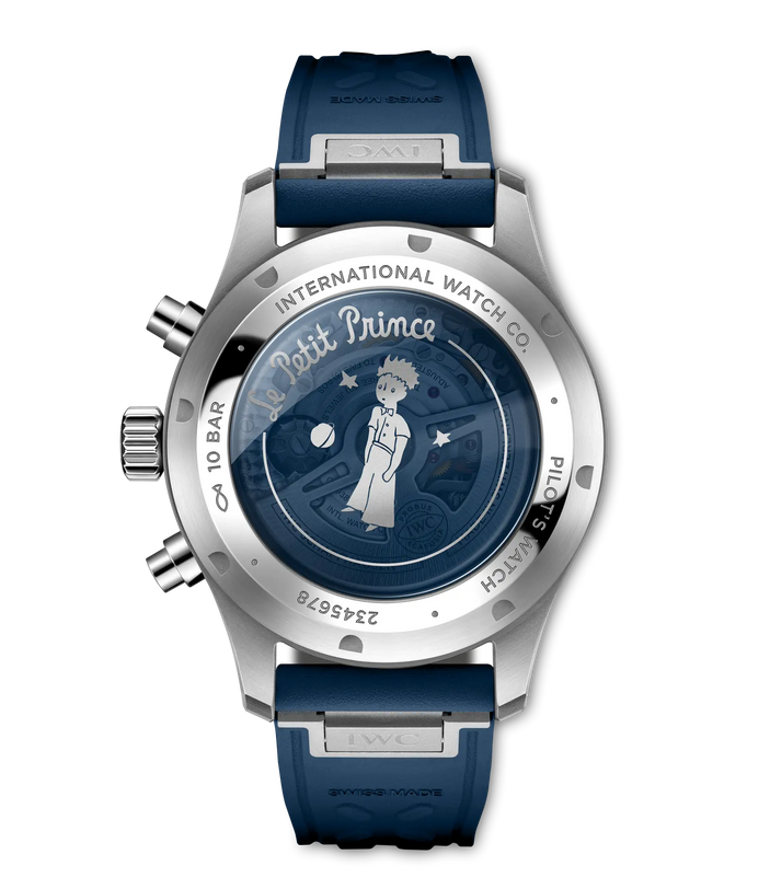 Stainless steel chronograph watch with dark blue dial featuring Le Petit Prince illustration, blue rubber strap, and chronogr