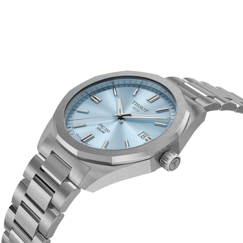 Silver Tissot watch with a blue face on a white background