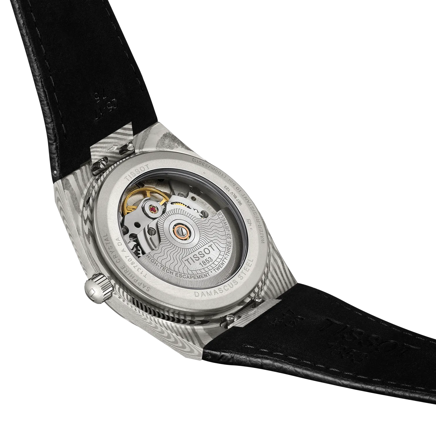 The image displays the back of a Tissot PRX 38 watch with a transparent case, showcasing its intricate automatic movement. It features a black leather strap and an engraved stainless steel case.