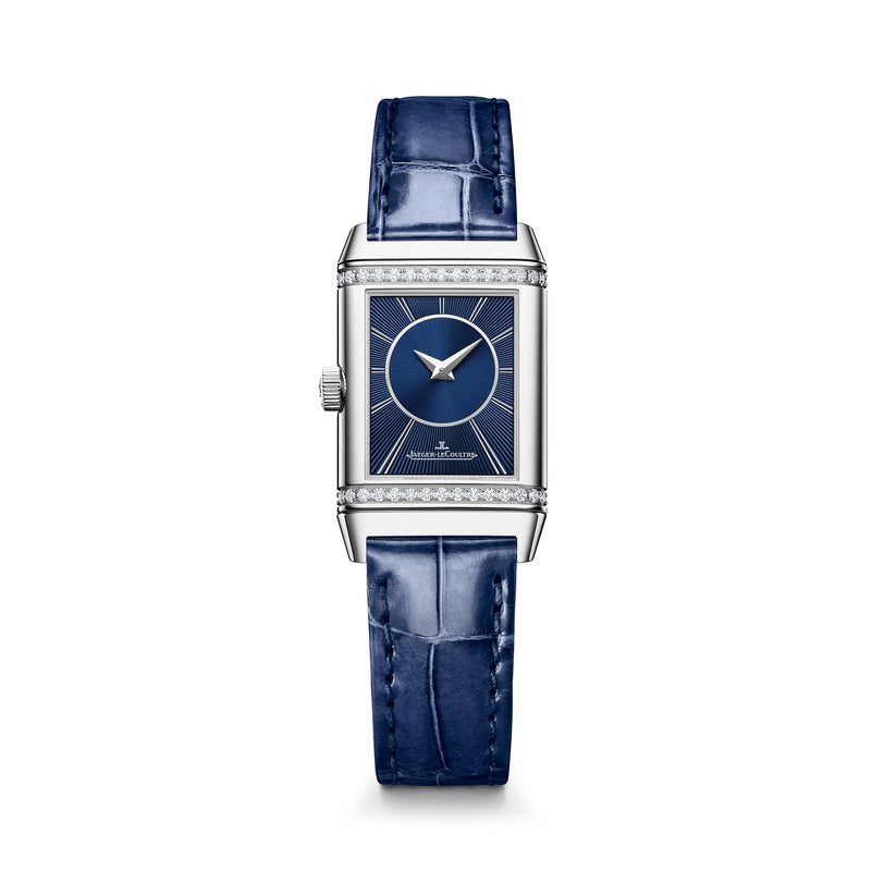 Rectangular silver watch with diamond bezel, blue dial, white hands, and blue alligator leather strap.