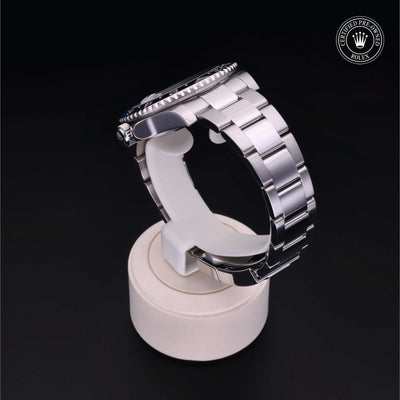 Rolex Certified Pre-owned GMT M116710BLNR-0002 front on black background